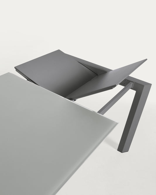 Taula extensible Axis de vidre gris i potes d'acer acabat gris fosc 160 (220) cm