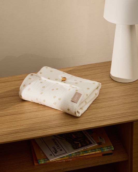 Canviador portàtil Olna de 100% cotó estampat sols