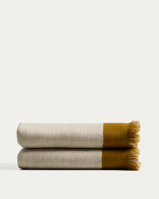 Manta Orlet de llana reversible mostassa i beix 130 x 170 cm