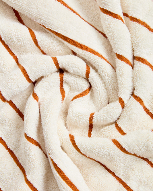 Tovallola Dorane 100 % cotó amb ratlles taronja 50 x 90 cm